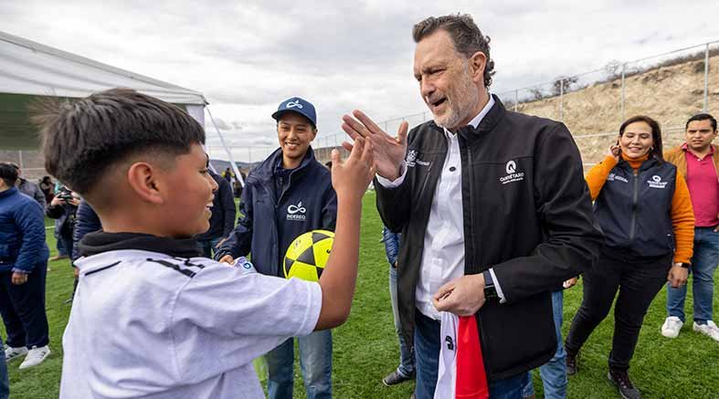 a man giving a boy a high five